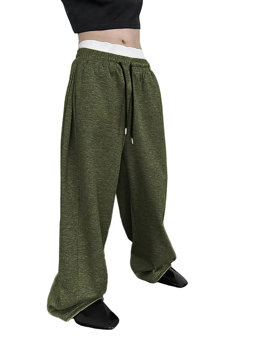 Green wide-leg pants worn by a person on a white background