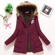 Maroon winter coat with fur hood on a white background