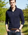 Navy blue long-sleeve polo shirt worn by a person on a white background