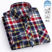 Folded plaid shirt with visible brand logo on a white background