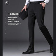 A man wearing slim black trousers, a white dress shirt, and black dress shoes, holding a black folder against a dark gray studio background with promotional text about casual men's trousers.