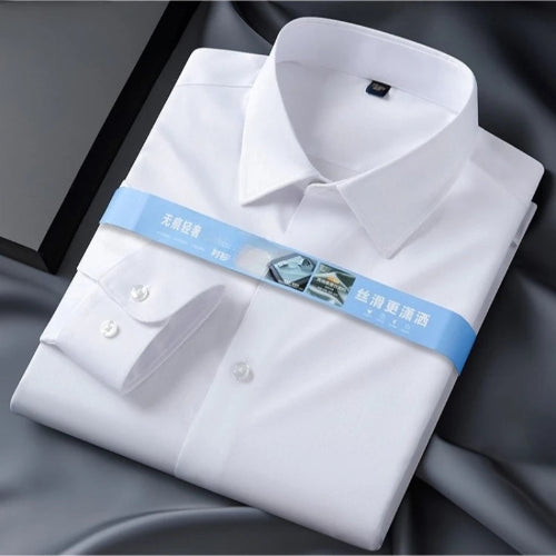 Folded white dress shirt with a blue tag on a dark background