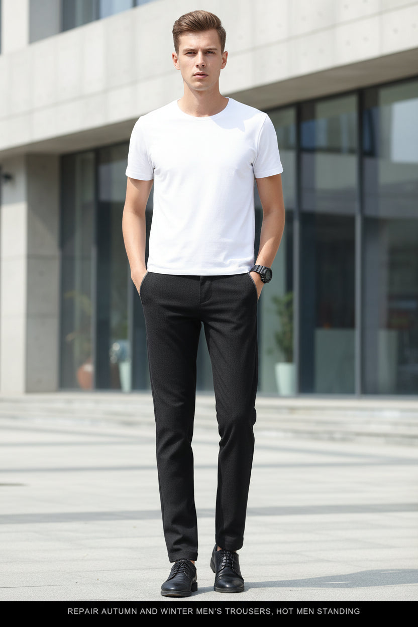 Black men's trousers worn by a person on a gray background