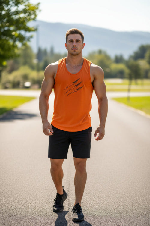 A close-up of a muscular man wearing a bright orange sleeveless tank top with a black claw graphic on the chest, set against a plain light background.