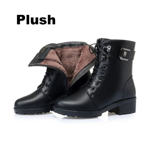 Black leather boots with plush lining on a white background, featuring the brand 'Plush'.