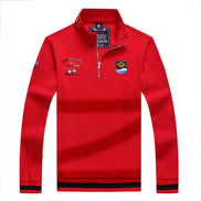 Red long-sleeve shirt with multiple logos on a white background