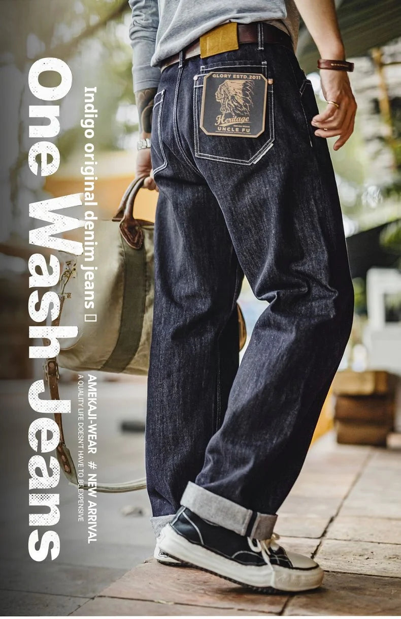 Person wearing one wash jeans with text on the left side.