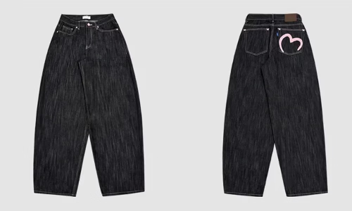Front and back views of dark-wash loose-fit jeans with contrast stitching and a pink heart outline on the right back pocket.