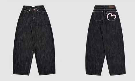 Front and back views of dark-wash loose-fit jeans with contrast stitching and a pink heart outline on the right back pocket.