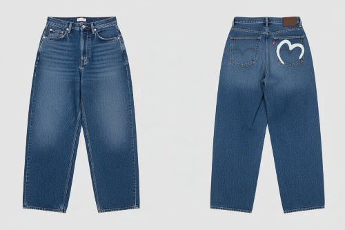 Black jeans displayed from front and back on a light gray background