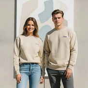 A beige crewneck sweatshirt with a small purple embroidered 'Dtime' logo on the left chest, displayed on a clean white background.