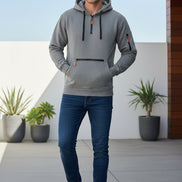 Gray hoodie with black and orange zippers on a white background