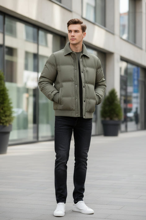 An olive green men's puffer jacket with a ribbed corduroy collar, shown open to reveal a dark gray inner lining. The jacket is displayed against a neutral gray background with a promotional badge on the left highlighting its duck down technology, and the brand name 'LANGBEEYAR' is visible in the top left corner.