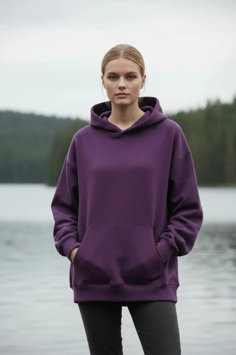 Purple hoodie worn by a person on a white background