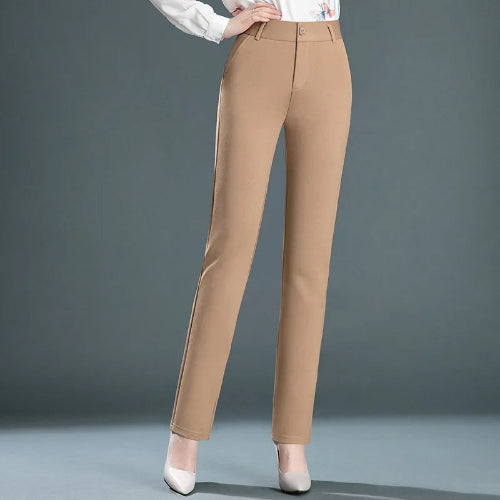 Beige pants worn by a person on a gray background