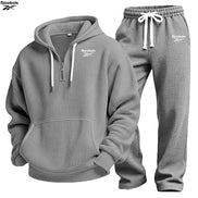 Gray textured hoodie and jogger pants set on a white background