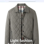 A men's quilted jacket in a muted gray-green color, featuring a diamond-quilted pattern, a pointed collar, and a button-up front. It is displayed on a white background with promotional text overlays.