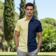 Two-tone yellow and navy shirt on a white background