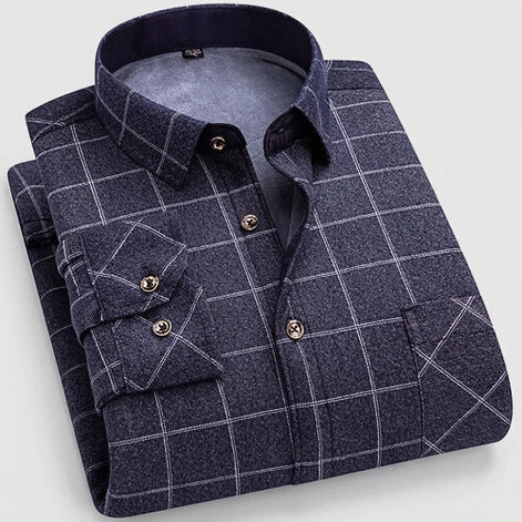 A folded men's long-sleeve plaid shirt in dark navy blue with white windowpane lines, shown on a light gray background. The image includes a circular inset 