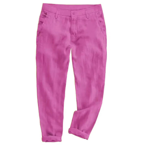 A pair of bright pink trousers with a relaxed, tapered fit and rolled cuffs, shown flat against a solid white background.