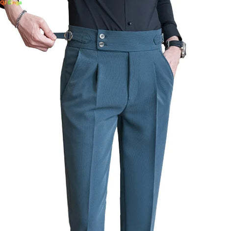 Blue pants with a belt being adjusted on a white background