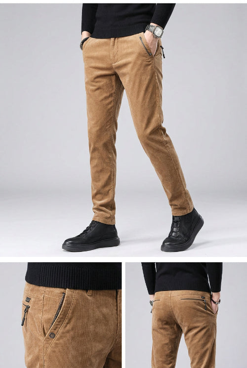 Brown corduroy pants worn by a person on a dark background