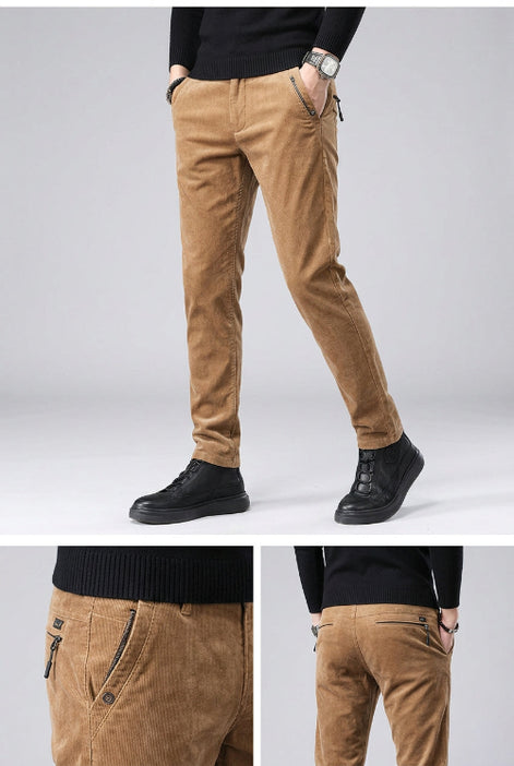 Brown corduroy pants worn by a person on a dark background