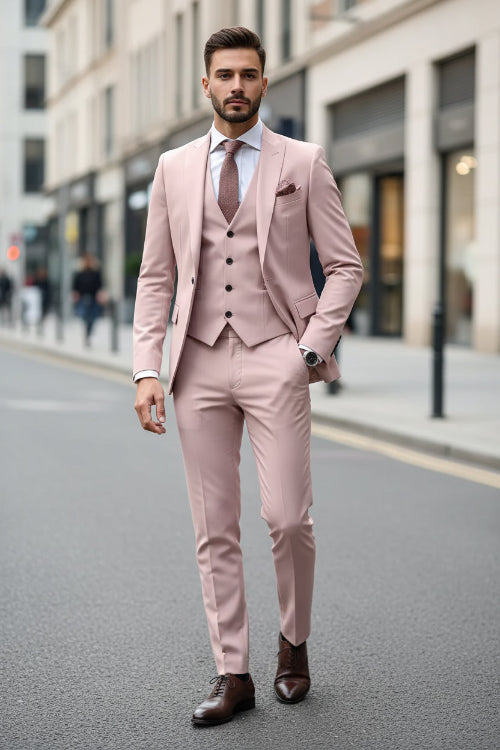 Man wearing a pink suit with a car in the background