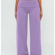 Person wearing purple wide-leg pants on a white background
