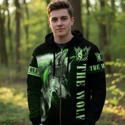 Black hoodie with green wolf design and 'The Wolf' text on a white background