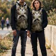 A black pullover hoodie featuring a large, realistic 3D-printed graphic of a fluffy brown tabby kitten with blue eyes 