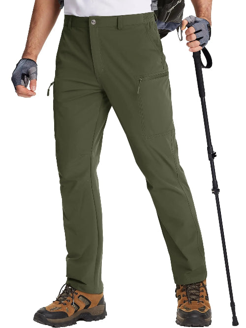 Person wearing green hiking pants with hiking boots and a walking stick on a white background