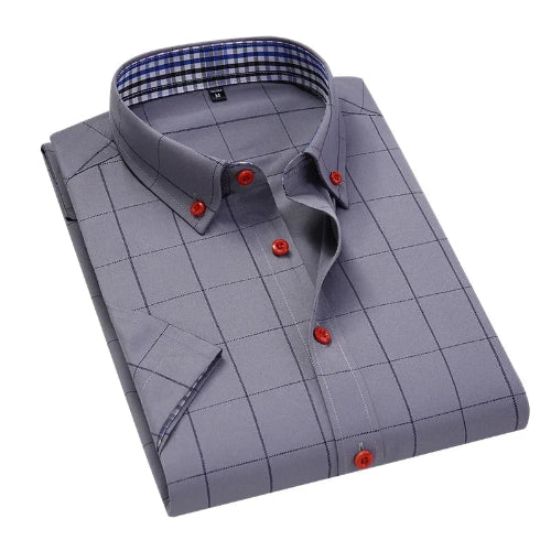 Folded gray checkered shirt with red buttons on a white background