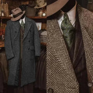 Vintage-style clothing including a gray overcoat, brown herringbone coat, and patterned tie in a rustic setting.