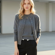 Gray cardigan worn by a person with a neutral background