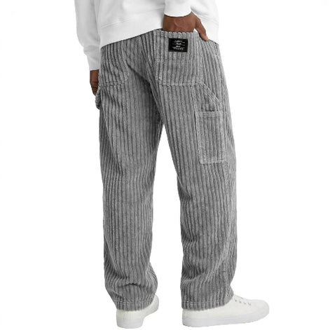 Gray striped pants worn by a person on a white background