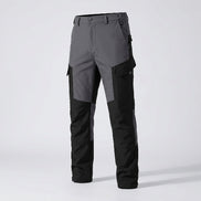 Black and gray cargo pants shown at an angle with a flame graphic overlay.