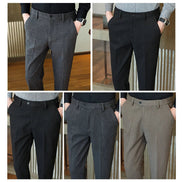 Four-panel collage showing men's tailored trousers in different colors, with the lower half of a model's body visible in each panel. The pants are shown in gray, black, and taupe, 