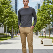 Beige pants worn by a person on a gray background with a brand logo at the top.
