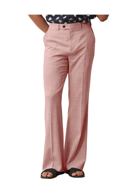 Pink pants worn by a person on a white background