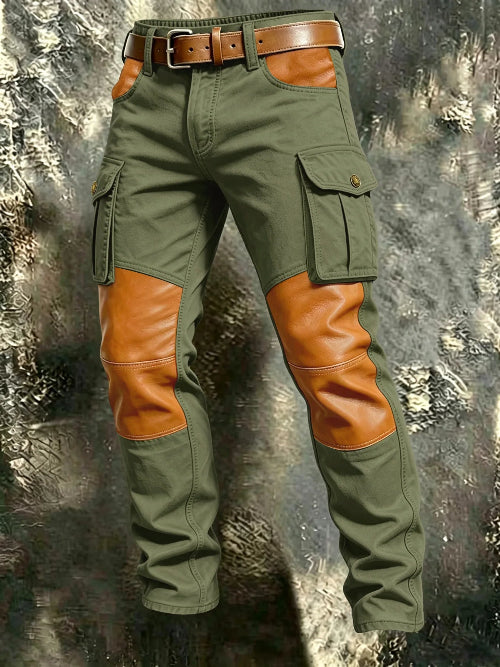 Olive green cargo pants with tan contrast panels at the knees and front pockets, flap thigh pockets, and a brown belt against a textured gray background.