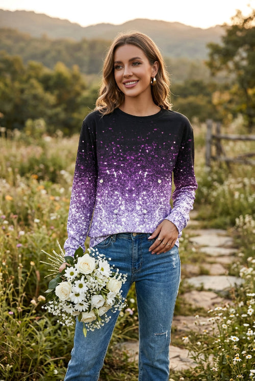 A woman wearing a long-sleeve crewneck top covered in sequins that fade from black at the top to bright 
