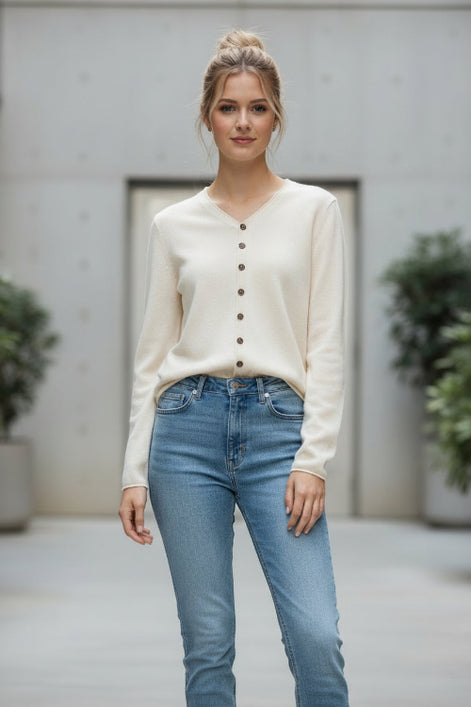 Beige cardigan worn by a person in a clothing store setting