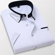 White dress shirt with black collar on a light gray background
