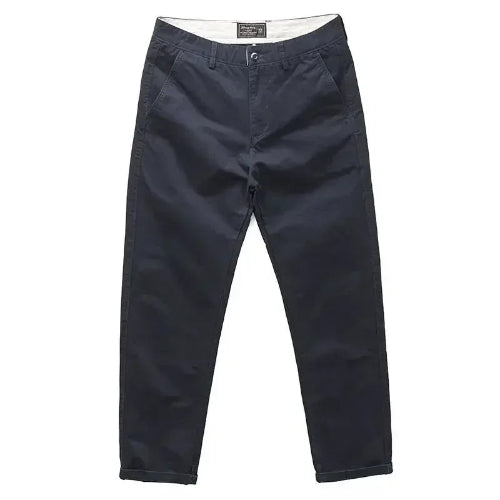 A pair of dark navy blue chino pants shown flat against a solid white background.