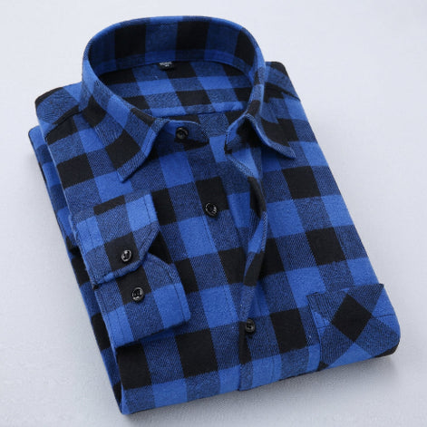 Folded blue and black checkered shirt on a white background