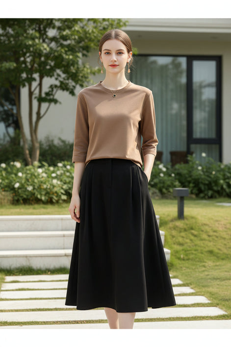 Mannequin wearing a brown long-sleeve shirt with a neutral background