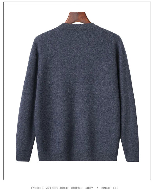 A dark heather gray knit sweater displayed on a wooden hanger against a white background.