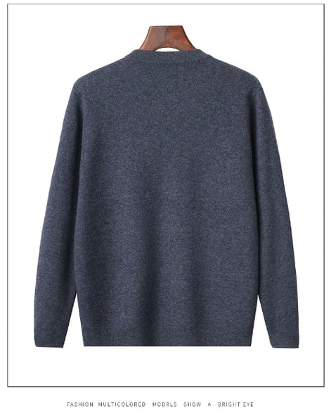 A dark heather gray knit sweater displayed on a wooden hanger against a white background.