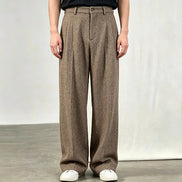 Khaki herringbone wide-leg pants shown on a white background